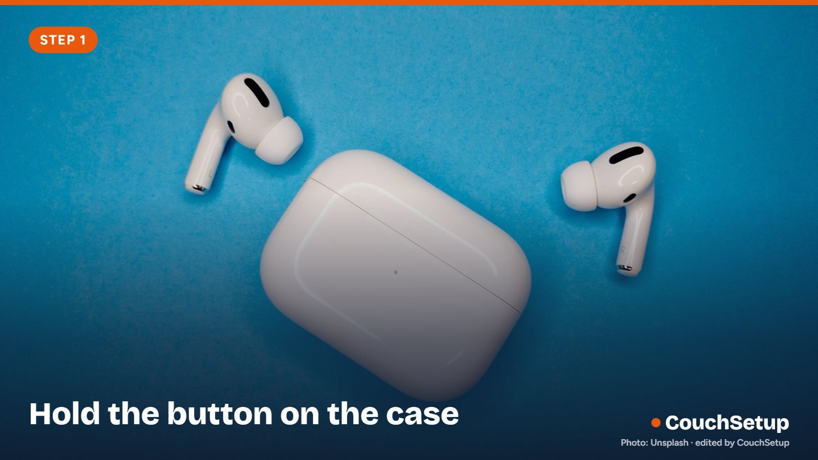 An open AirPods case with the status light on